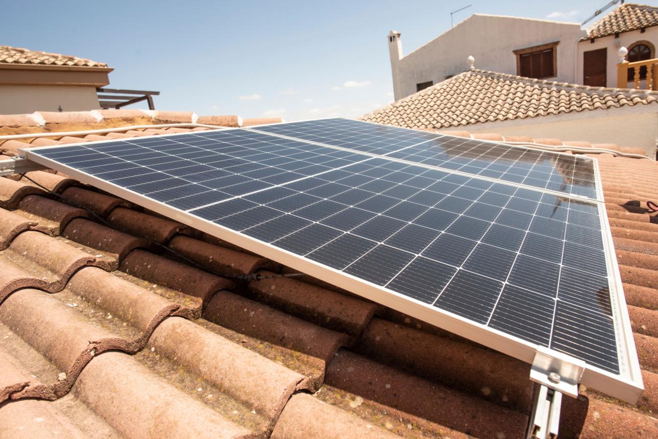 Solar panel on a roof in sunny day, classic house roof